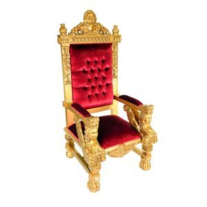 Location d'un trône de noël majestueux aux couleurs éclatantes de rouge et d'or, orné de détails élégants.